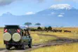 Safari vehicle in front of Mt Kilimanjaro in Amboseli National Park